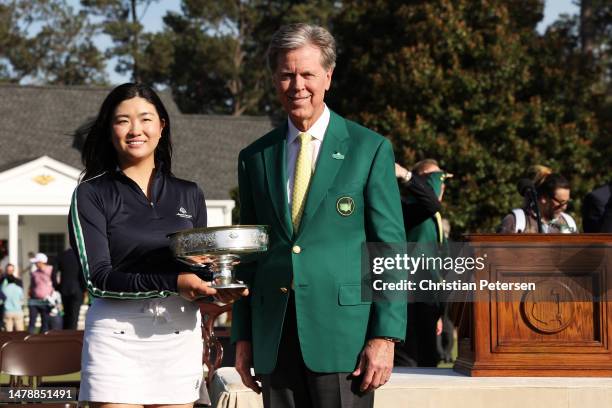 Rose Zhang of the United States celebrates with the trophy and Fred Ridley, Chairman of Augusta National Golf Club, after winning in a playoff during...