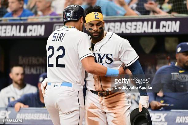 Jose Siri celebrates with Yandy Diaz of the Tampa Bay Rays after scoring in the third inning against the Detroit Tigers at Tropicana Field on April...