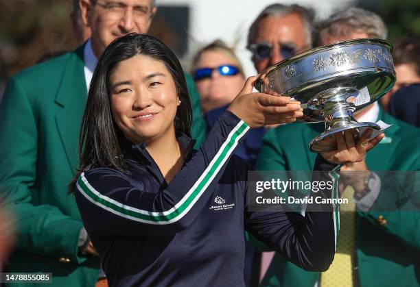 Rose Zhang of The United States raises the trophy after her play-off win during the final round of the Augusta National Women's Amateur at Augusta...