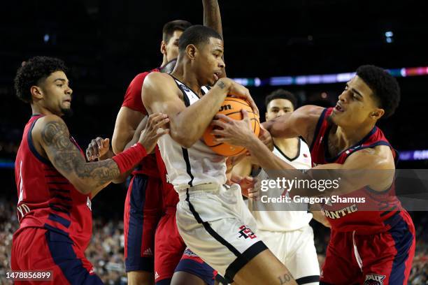 Keshad Johnson of the San Diego State Aztecs and Bryan Greenlee of the Florida Atlantic Owls battle for the ball during the first half during the...