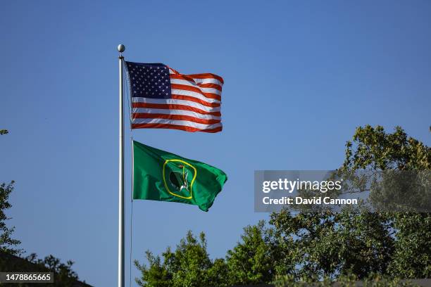 The American flag and the flag of The Augusta National Golf Club fly above the clubhouse during the final round of the Augusta National Women's...