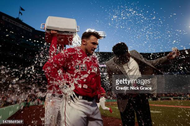 Adam Duvall of the Boston Red Sox is showered in Gatorade after hitting a walk off home run against the Baltimore Orioles at Fenway Park on April 01,...