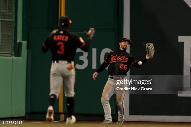 Ryan McKenna of the Baltimore Orioles drops what would have been the game ending out during the ninth inning against the Boston Red Sox at Fenway...