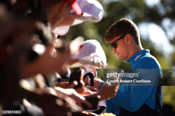 Logan Sargeant of United States and Williams greets fans on the Melbourne Walk prior to the F1 Grand Prix of Australia at Albert Park Grand Prix...