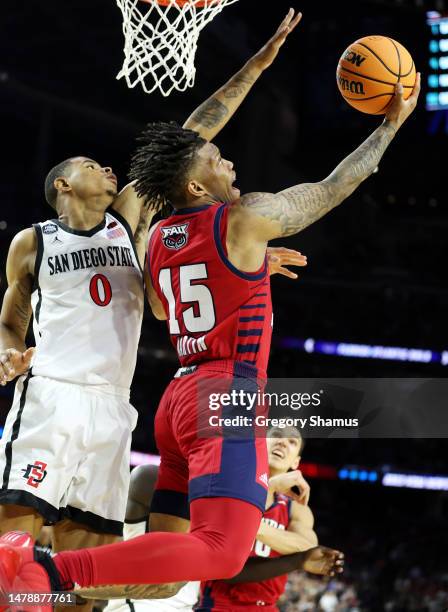 Alijah Martin of the Florida Atlantic Owls shoots the ball against Keshad Johnson of the San Diego State Aztecs during the second half during the...