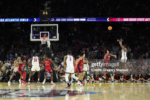 Lamont Butler of the San Diego State Aztecs makes a basket as the clock expires to defeat the Florida Atlantic Owls 72-71 during the NCAA Men's...