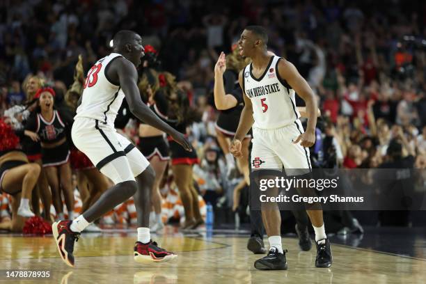 Lamont Butler of the San Diego State Aztecs celebrates with Aguek Arop after making a game winning basket to defeat the Florida Atlantic Owls 72-71...