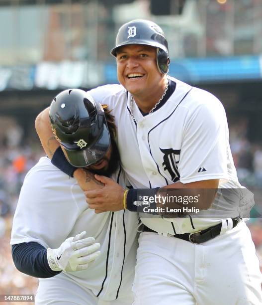 Prince Fielder of the Detroit Tigers is congratulated by teammate Miguel Cabrera after hitting a three-run home run in the eighth inning against the...