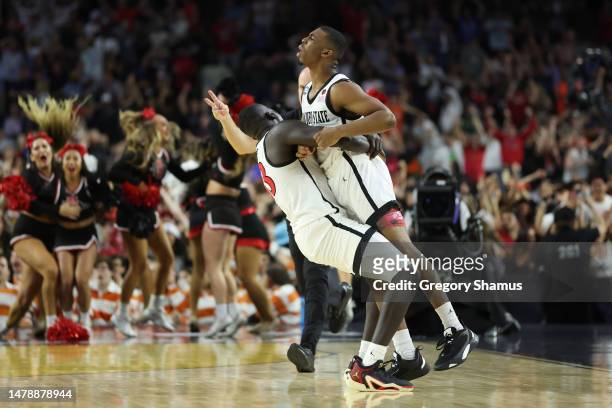 Lamont Butler of the San Diego State Aztecs celebrates with Aguek Arop after making a game winning basket to defeat the Florida Atlantic Owls 72-71...