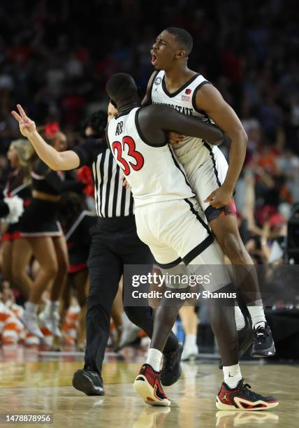 Lamont Butler of the San Diego State Aztecs celebrates with Aguek Arop after making a game winning basket to defeat the Florida Atlantic Owls 72-71...