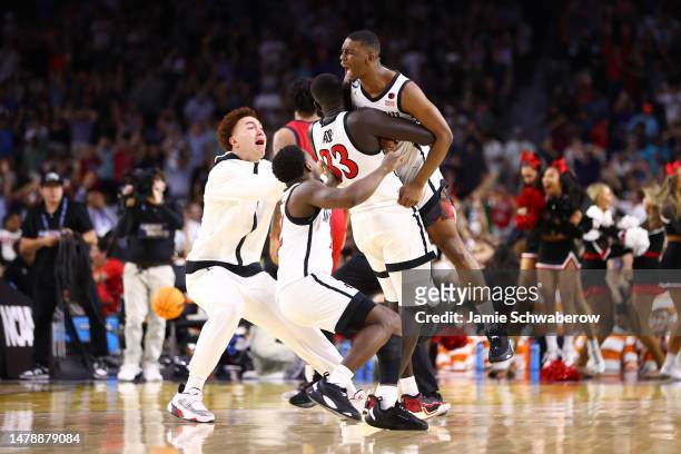Lamont Butler of the San Diego State Aztecs celebrates with teammates after winning the game against the Florida Atlantic Owls during the NCAA Men’s...