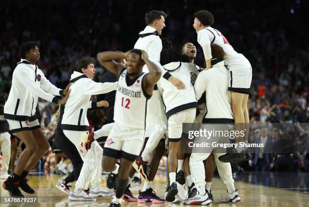 The San Diego State Aztecs celebrate after defeating the Florida Atlantic Owls 72-71 during the NCAA Men's Basketball Tournament Final Four semifinal...