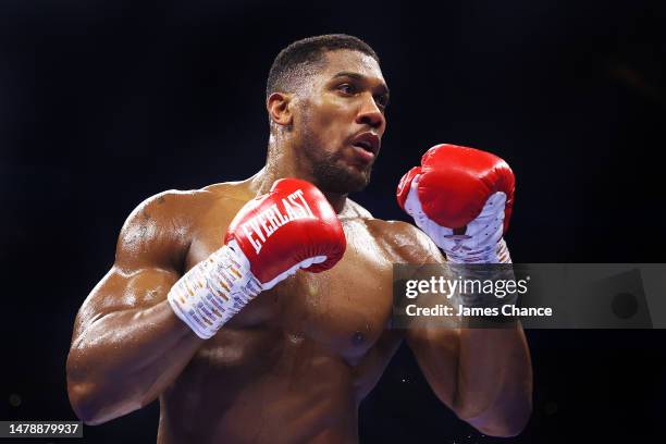 Anthony Joshua looks on during the Heavyweight fight between Anthony Joshua and Jermaine Franklin at The O2 Arena on April 01, 2023 in London,...