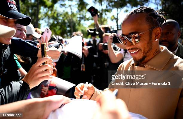 Lewis Hamilton of Great Britain and Mercedes greets fans on the Melbourne Walk prior to the F1 Grand Prix of Australia at Albert Park Grand Prix...