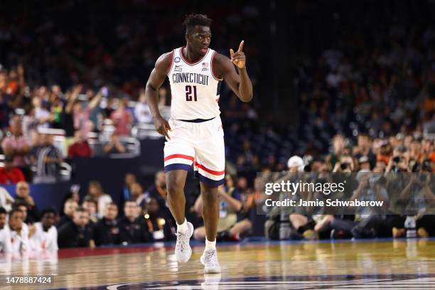 Adama Sanogo of the Connecticut Huskies runs down court in the first half during the NCAA Men’s Basketball Tournament Final Four semifinal game...