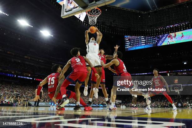 Keshad Johnson of the San Diego State Aztecs shoots against Giancarlo Rosado of the Florida Atlantic Owls during the first half during the NCAA Men's...