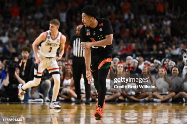 Nijel Pack of the Miami Hurricanes reacts after making a three-point basket against the Connecticut Huskies in the first half during the NCAA Men’s...