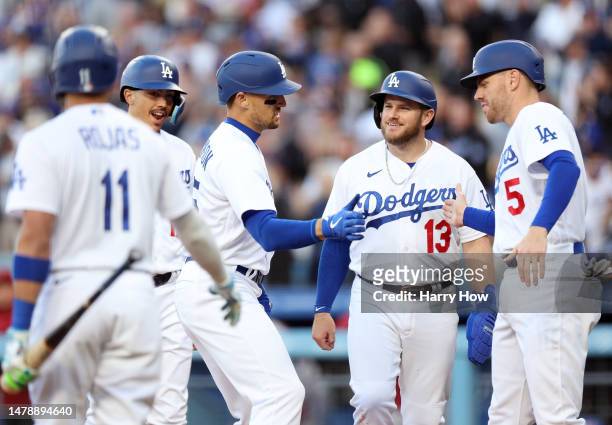 Trayce Thompson of the Los Angeles Dodgers celebrates his grand slam homerun with Freddie Freeman, Max Muncy, Miguel Vargas and Miguel Rojas, to take...