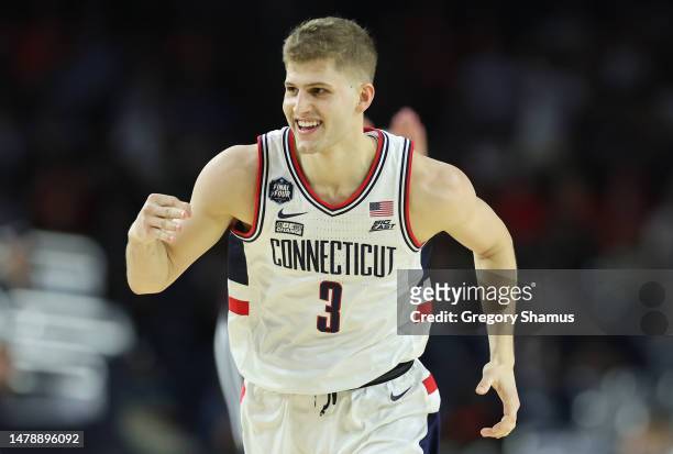 Joey Calcaterra of the Connecticut Huskies reacts after a three-point basket during the first half against the Miami Hurricanes during the NCAA Men's...