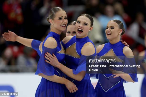 Team Unique of Finland reacts after the performance in the free skate during the ISU World Synchronized Skating Championships at Herb Brooks Arena on...