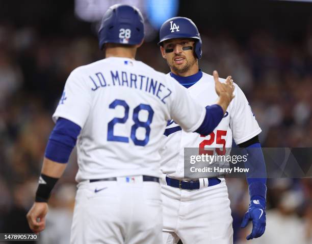 Trayce Thompson of the Los Angeles Dodgers celebrates his three run homerun, his second homerun of the game, with J.D. Martinez, to take an 6-1 lead...