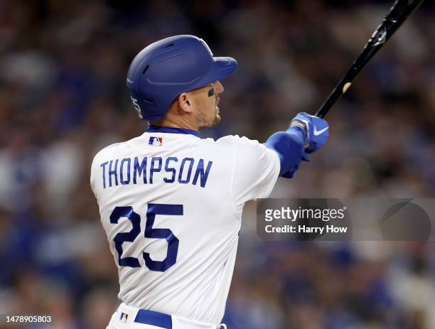 Trayce Thompson of the Los Angeles Dodgers watches = his three run homerun, his second homerun of the game, to take an 6-1 lead over the Arizona...