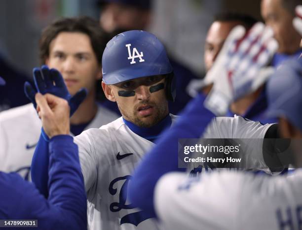 Trayce Thompson of the Los Angeles Dodgers celebrates his solo homerun, his third homerun of the game, to take a 10-1 lead over the Arizona...