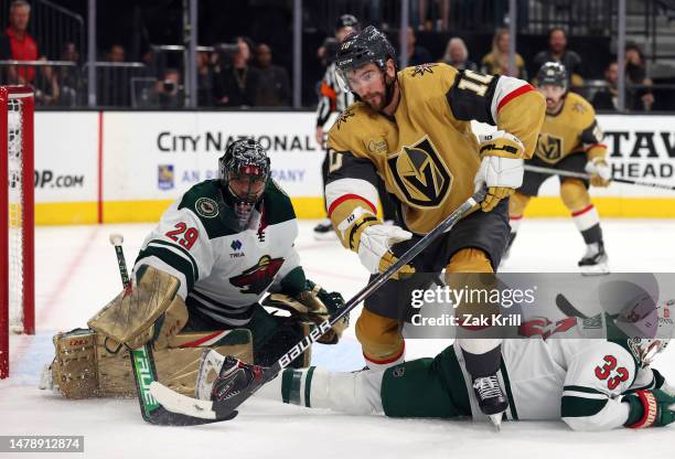 Nicolas Roy of the Vegas Golden Knights battles for the puck near the net of Marc-Andre Fleury of the Minnesota Wild during the second period at...