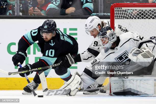 Matty Beniers of the Seattle Kraken attempts a wrap-around shot against Pheonix Copley of the Los Angeles Kings during the third period at Climate...