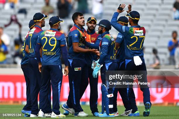 Maheesh Theekshana of Sri Lanka celebrates the wicket of Jimmy Neesham of the Black Caps in the super over during game one in the T20 International...