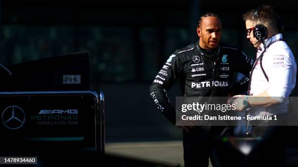 Lewis Hamilton of Great Britain and Mercedes talks with race engineer Peter Bonnington in the Pitlane during the red flag delay during the F1 Grand...