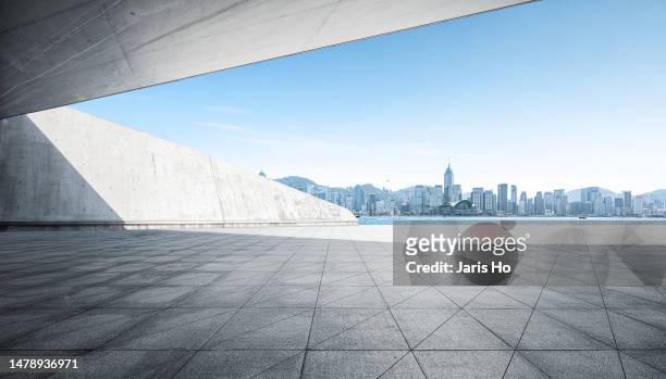 empty abstract concrete space with city skyline - commercial buildings hong kong morning stock pictures, royalty-free photos & images