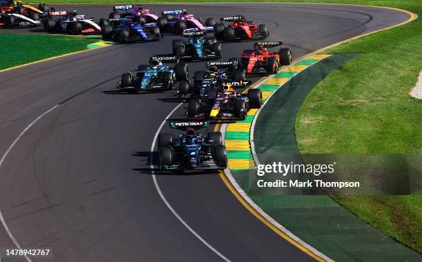 George Russell of Great Britain driving the Mercedes AMG Petronas F1 Team W14 leads Max Verstappen of the Netherlands driving the Oracle Red Bull...