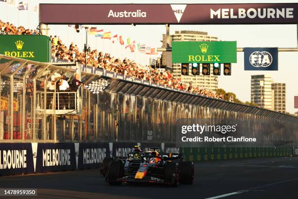 Race winner Max Verstappen of the Netherlands driving the Oracle Red Bull Racing RB19 takes the chequered flag during the F1 Grand Prix of Australia...