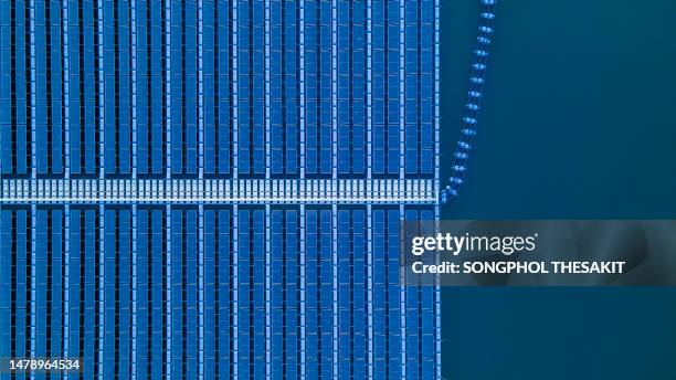 aerial view/solar cells float clean energy that will be the energy of the future. - hydroelectric power stock pictures, royalty-free photos & images
