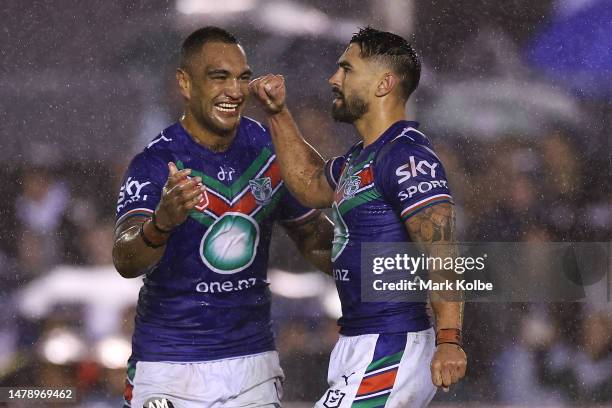 Marata Niukore and Shaun Johnson of the Warriors celebrate Shaun Johnson kicking a penalty goal to give the Warriors the lead during the round five...