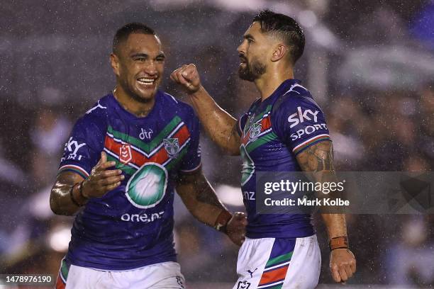 Marata Niukore and Shaun Johnson of the Warriors celebrate Shaun Johnson kicking a penalty goal to give the Warriors the lead during the round five...