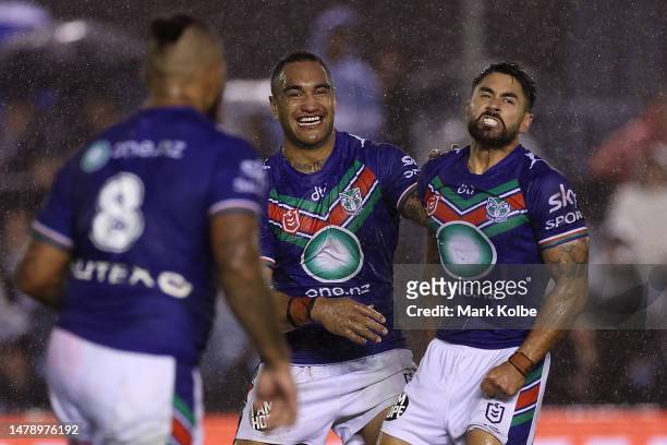 Marata Niukore and Shaun Johnson of the Warriors celebrate Shaun Johnson kicking a penalty goal to give the Warriors the lead during the round five...