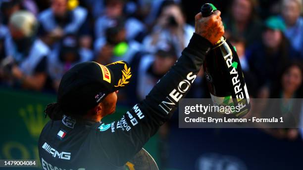 Second placed Lewis Hamilton of Great Britain and Mercedes celebrates on the podium during the F1 Grand Prix of Australia at Albert Park Grand Prix...