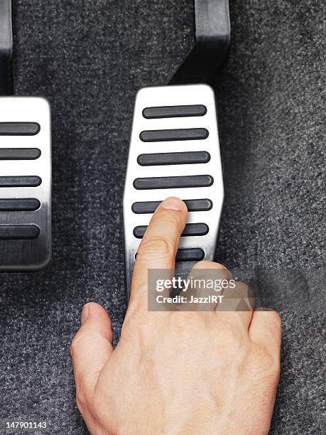 his fingers pressed the gas pedal - gaspedaal stockfoto's en -beelden