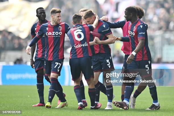 Stefan Posch of Bologna FC celebrates with teammates after scoring the team's first goal during the Serie A match between Bologna FC and Udinese...