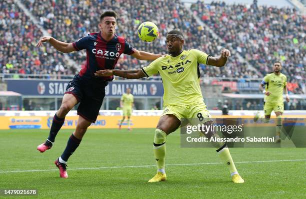 Nikola Moro of Bologna FC battles for possession with Marvin Zeegelaar of Udinese Calcio during the Serie A match between Bologna FC and Udinese...