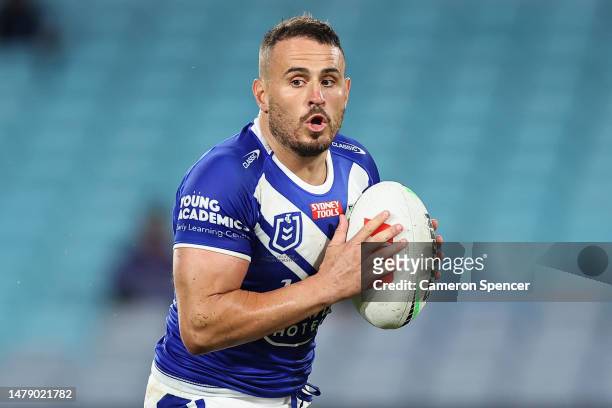 Josh Reynolds of the Bulldogs passes during the round five NRL match between Canterbury Bulldogs and North Queensland Cowboys at Accor Stadium on...