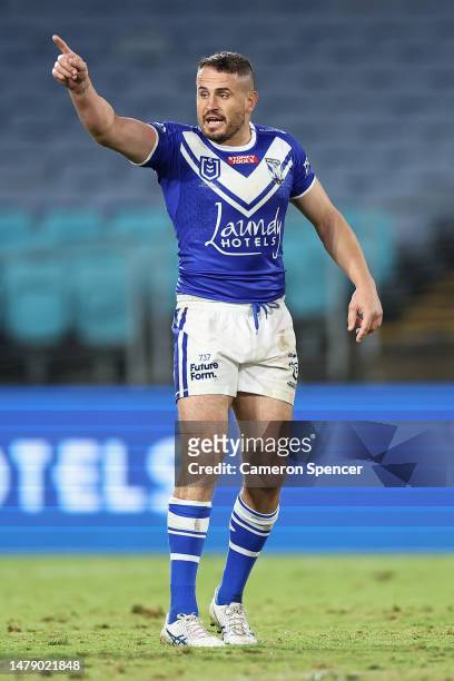 Josh Reynolds of the Bulldogs talks to team mates during the round five NRL match between Canterbury Bulldogs and North Queensland Cowboys at Accor...