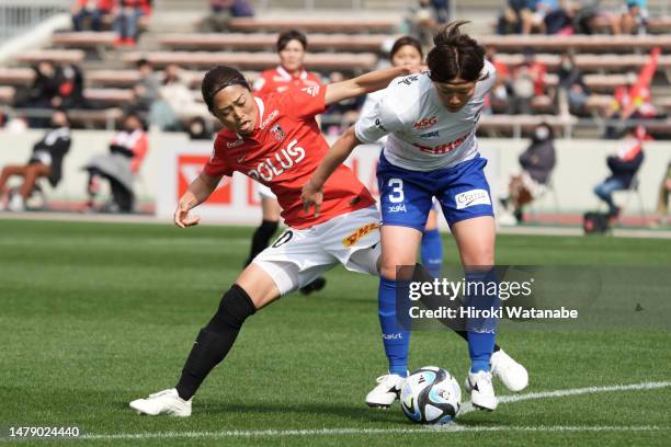 Hisui Haza of Albirex Niigata Ladies and Kozue Ando of MHI Urawa Reds Ladies compete for the ball during the WE League match between Mitsubishi Heavy...