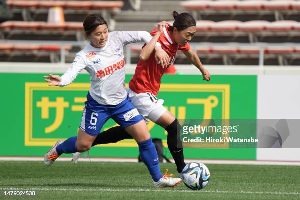 Saki Yanagisawa of Albirex Niigata Ladies and Kozue Ando of MHI Urawa Reds Ladies compete for the ball during the WE League match between Mitsubishi...