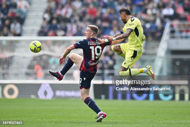 Lewis Ferguson of Bologna FC battles for possession with Roberto Pereyra of Udinese Calcio during the Serie A match between Bologna FC and Udinese...
