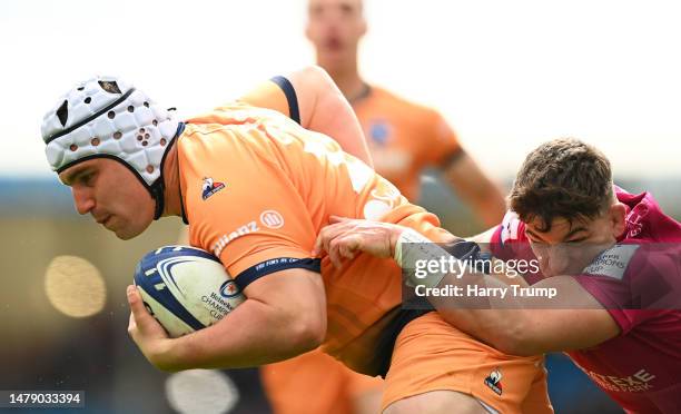 Curtis Langdon of Montpellier breaks the tackle of Dan Frost of Exeter Chiefs to score their sides first try during the Heineken Champions Cup Round...