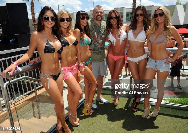 Personalities Arianny Celeste, Brittney Palmer, Kenda Perez, Chuck Liddell, and Rachelle Leah pose for a photo during a pool party as part of the...