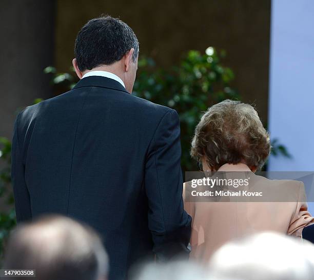 Chairman and CEO of The Walt Disney Company Robert A. Iger escorts Nancy Reagan off-stage at The Grand Opening of D23 Presents Treasures of The Walt...